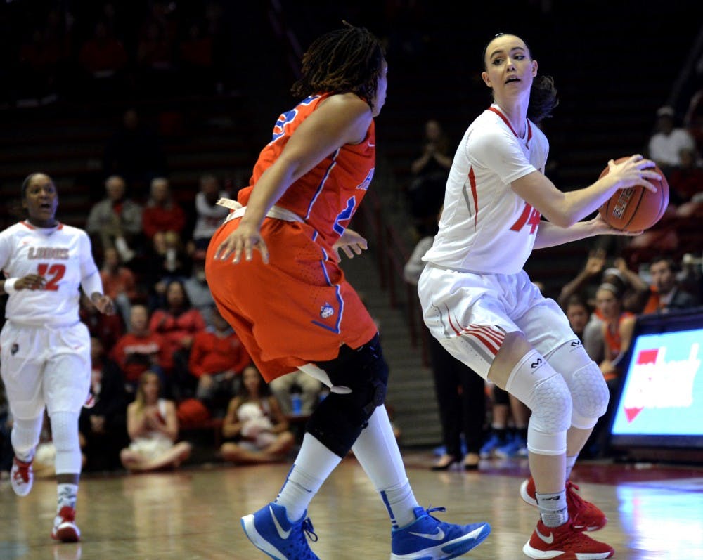 Freshman guard Jannon Otto drives past a Houston Baptist's forward Monet Neal&nbsp;at WisePies Arena Saturday Nov. 13. The Lobos lost to NMSU 78-59 Tuesday night.&nbsp;