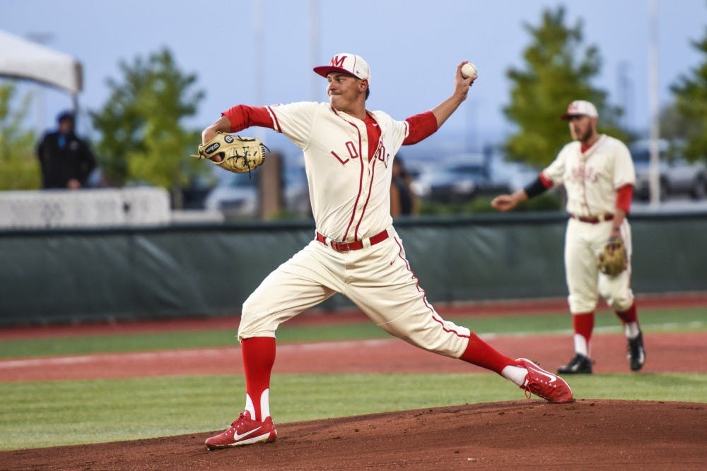 Senior Carson Schneider arches back before throwing a pitch against a Texas Tech batter Tuesday, April 25, 2017 at Santa Ana Star Field. The Lobo will compete against the New Mexico State Aggies this Tuesday at home.&nbsp;