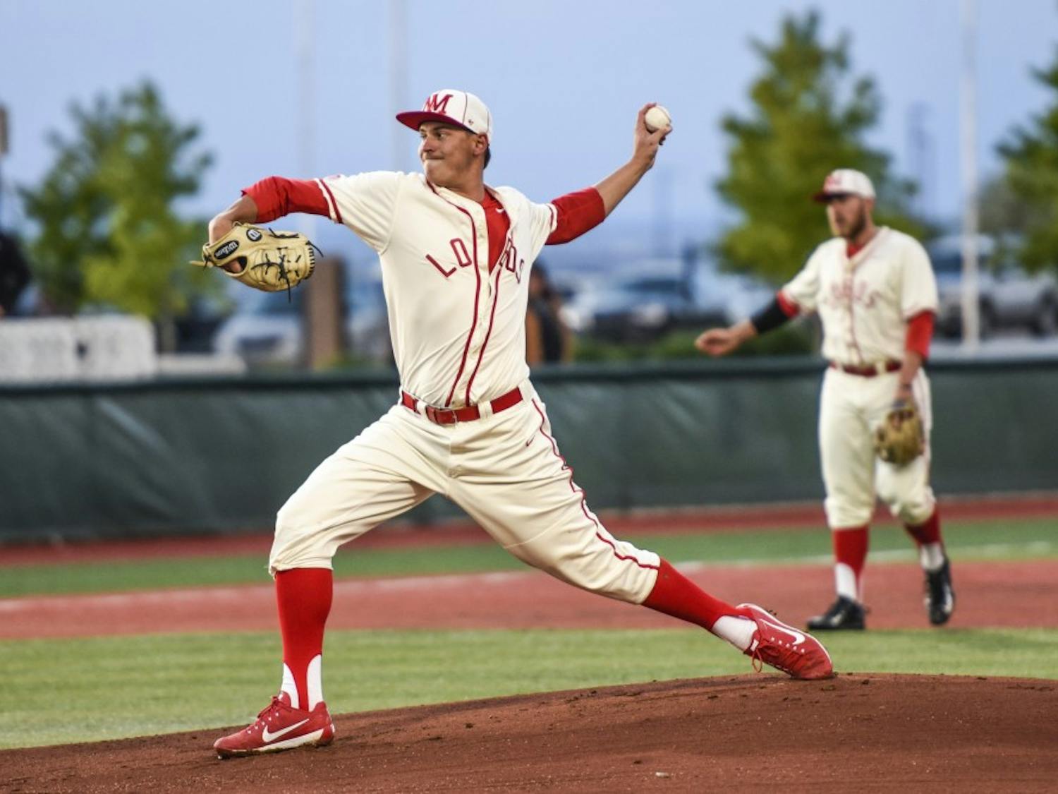 Senior Carson Schneider arches back before throwing a pitch against a Texas Tech batter Tuesday, April 25, 2017 at Santa Ana Star Field. The Lobo will compete against the New Mexico State Aggies this Tuesday at home. 