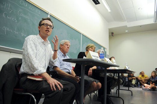 Jason Scott Smith speaks during a roundtable discussion on the economic crisis held in Dane Smith Hall on Friday. 