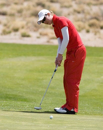 Alexadra Phelps putts at the UNM Championship Golf Course during the Mountain West Conference Championships on Thursday. The UNM women lead the tournament after day one.