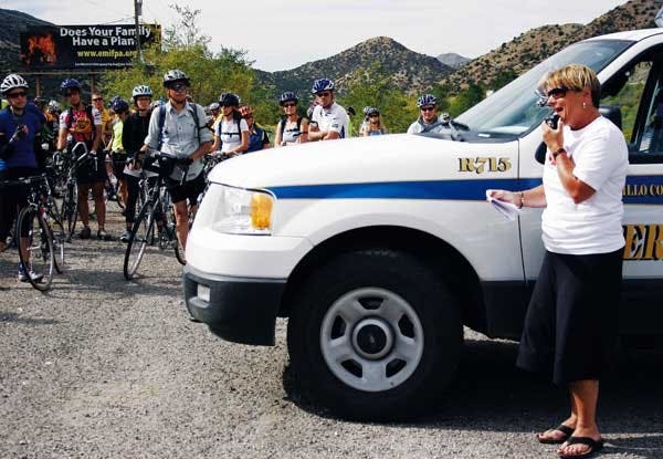 Maureen Quinn addresses a crowd of bicyclists at a memorial ride for her son, James, who died in a bike accident on Sept. 15. About 200 bicyclists rode from the law school to Tijeras Canyon for the memorial service.