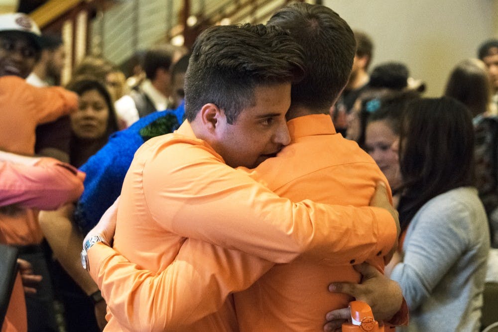Kyle Biederwolf embraces Justin Cooper after the election results on Wednesday night at the SUB. While Biederwolf won the presidential seat, running mate Cooper lost the vice president position to competitor Cheyenne Feltz during the 2016-2017 ASUNM election.