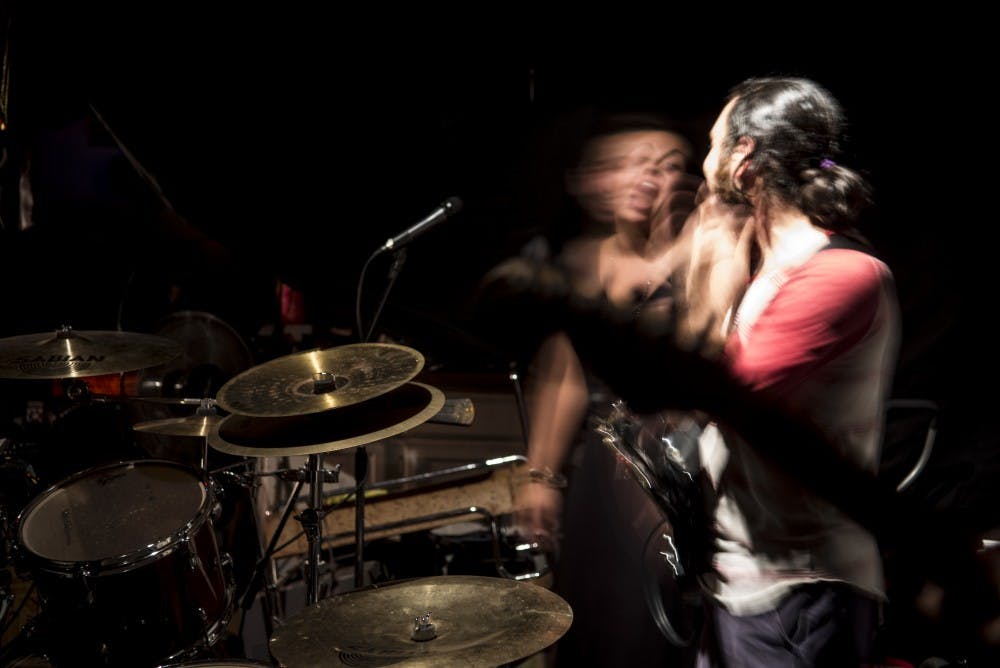 Bassist Barney Lopes, right, and&nbsp;lead vocalist Amanda Machon&nbsp;laugh during a practice Thursday, Sept. 8, 2016.