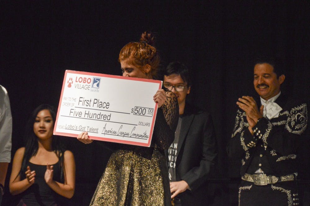 Gigi Bella holds her First Place prize following her slam poetry performance at the 2016 Lobos Got Talent show on Friday, Nov. 11, 2016 in the SUB Ballroom.