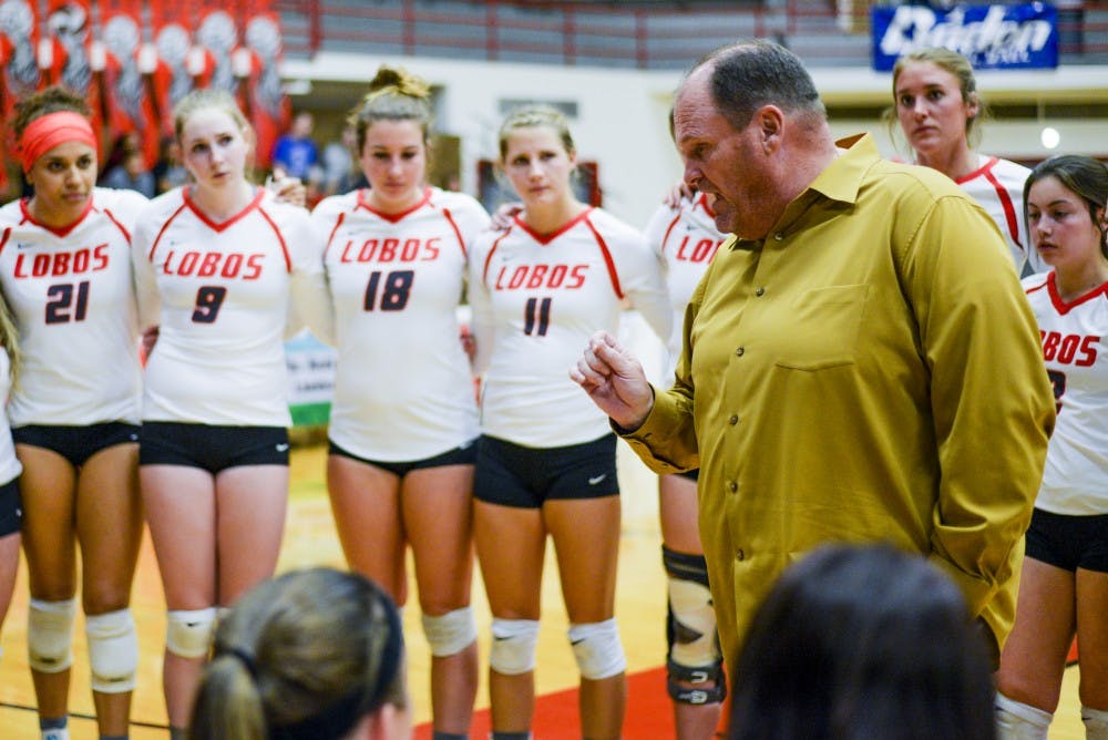 Head volleyball coach Jeff Nelson talks with his team during a break in&nbsp;the first set as the Lobos trailed Colorado State University on Thursday night.&nbsp;