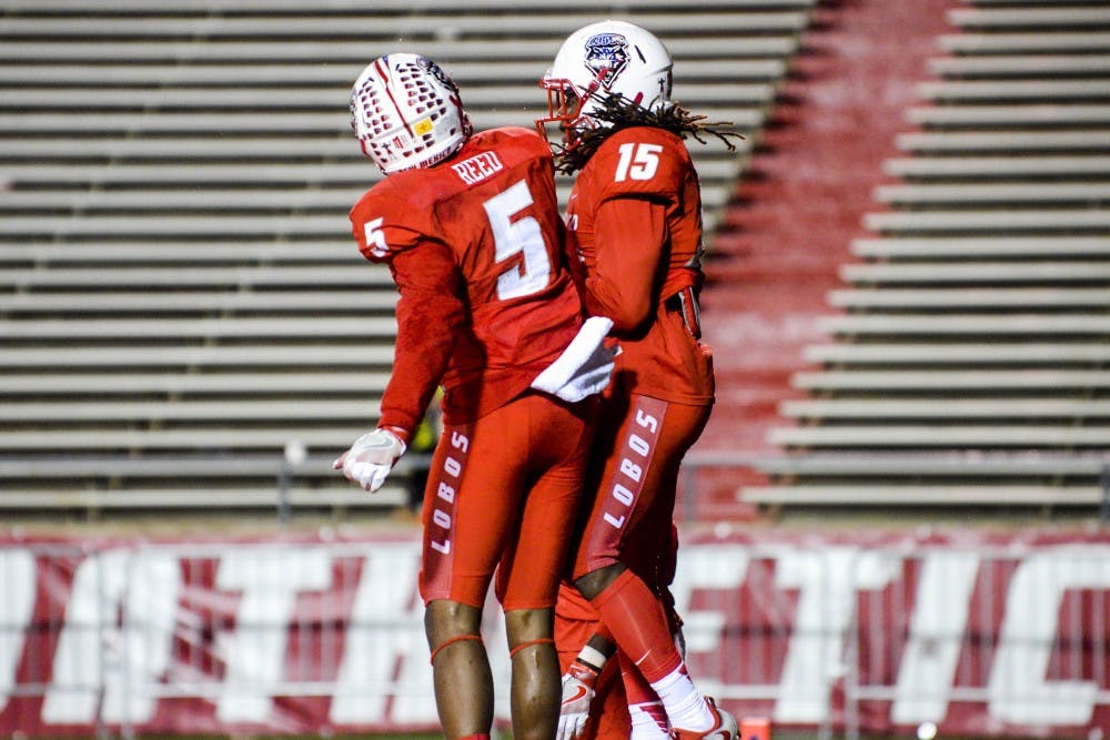 Wide receiver Patrick Reed and teammate Emmanuel Harris shoulder bump on Nov. 5, 2016 during a game against Nevada. 
