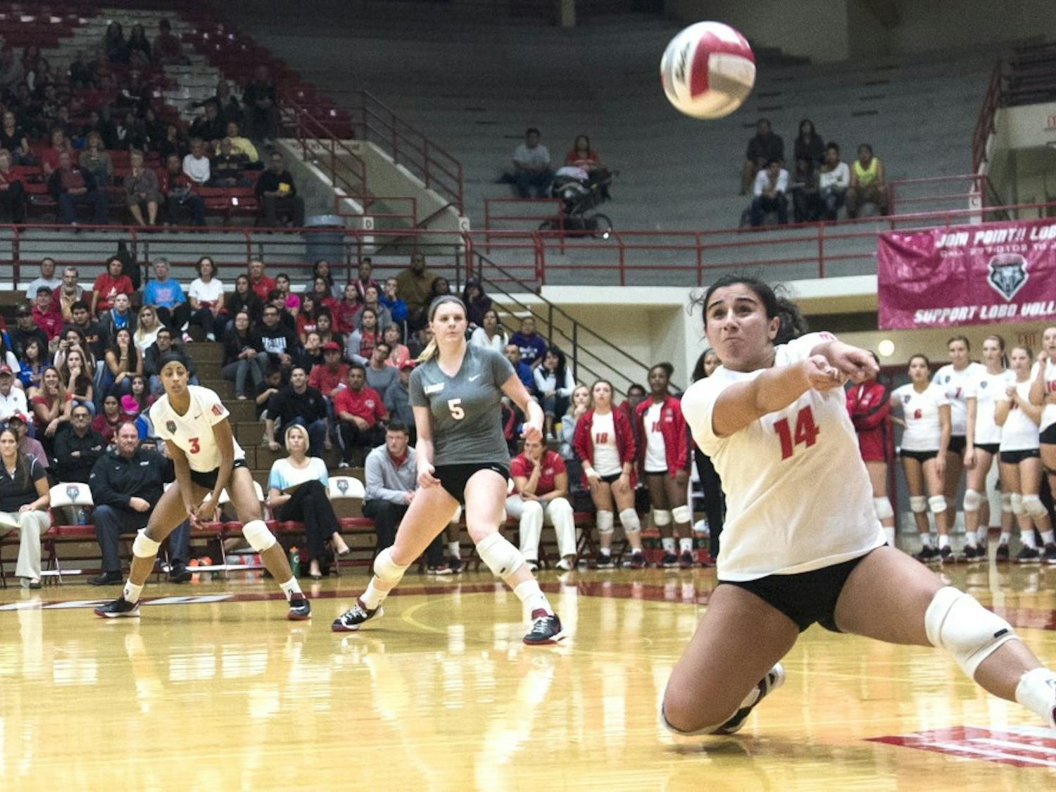 New Mexico defensive specialist Stephanie Chavez bumps the ball during the game against New Mexico State on Monday night. The Lobos swept the Aggies 3-0, snapping a four-match losing streak.