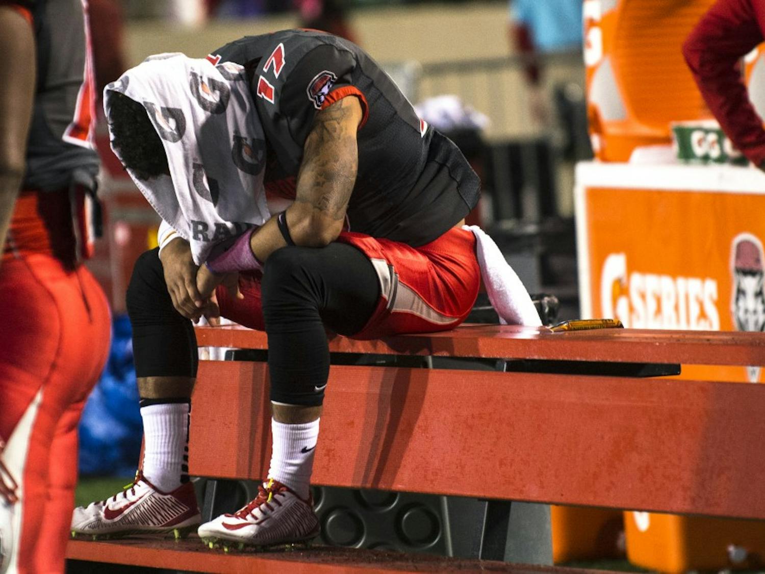 New Mexico defensive back Jadon Boatright hangs his head after the game against San Diego State at University Stadium on Friday. The Lobos fell 24-14 to the Aztecs.