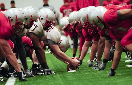 Offensive and defensive linemen from the Lobo football team square off against each other during Saturday's scrimmage at the Indoor Practice Facility.  