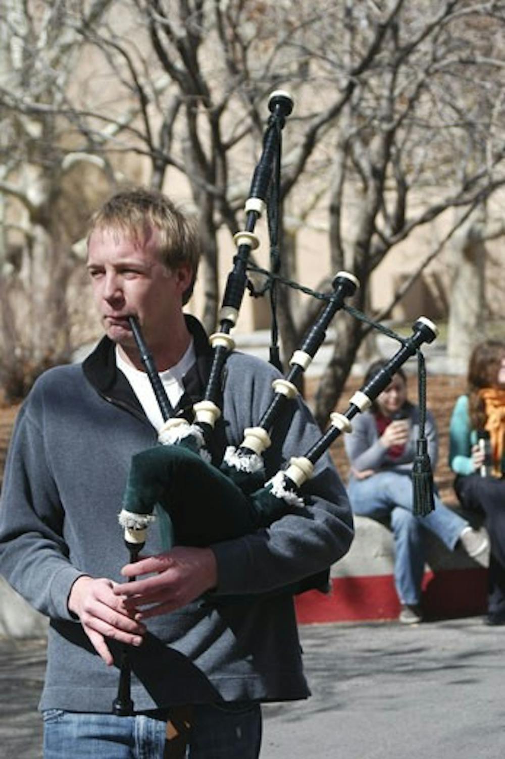 Student Bradley Kenna plays bagpipes Thursday near the Center for the Arts and Fine Arts. Bradley plays pipes and drums for the Shrine Band.