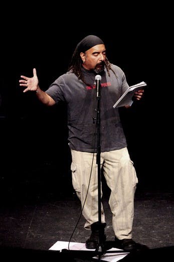 Winner of the Slam Poet Laureate competition, Danny Solis, recites a poem Saturday night at the KiMo Theatre. 