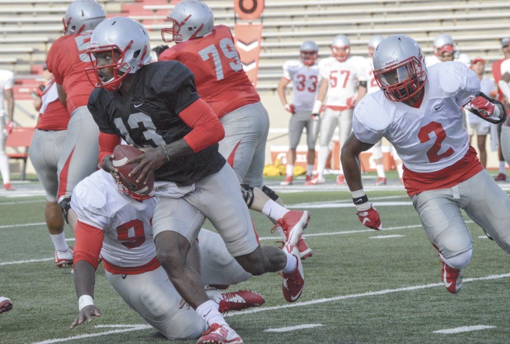 UNM redshirt sophomore quarterback Lamar Jordan runs the ball on Saturday evening. UNM’s first game will be against  Mississippi Valley State on Sept. 5 at University Stadium.