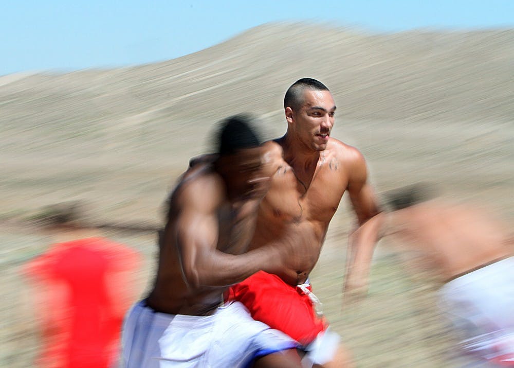 	UCLA transfer Drew Gordon sprints up hills during the Lobo basketball team’s rigorous workout on Saturday. The workouts, led by strength and condition coach Mark Paulsen, will be a part of UNM’s summer training regimen.