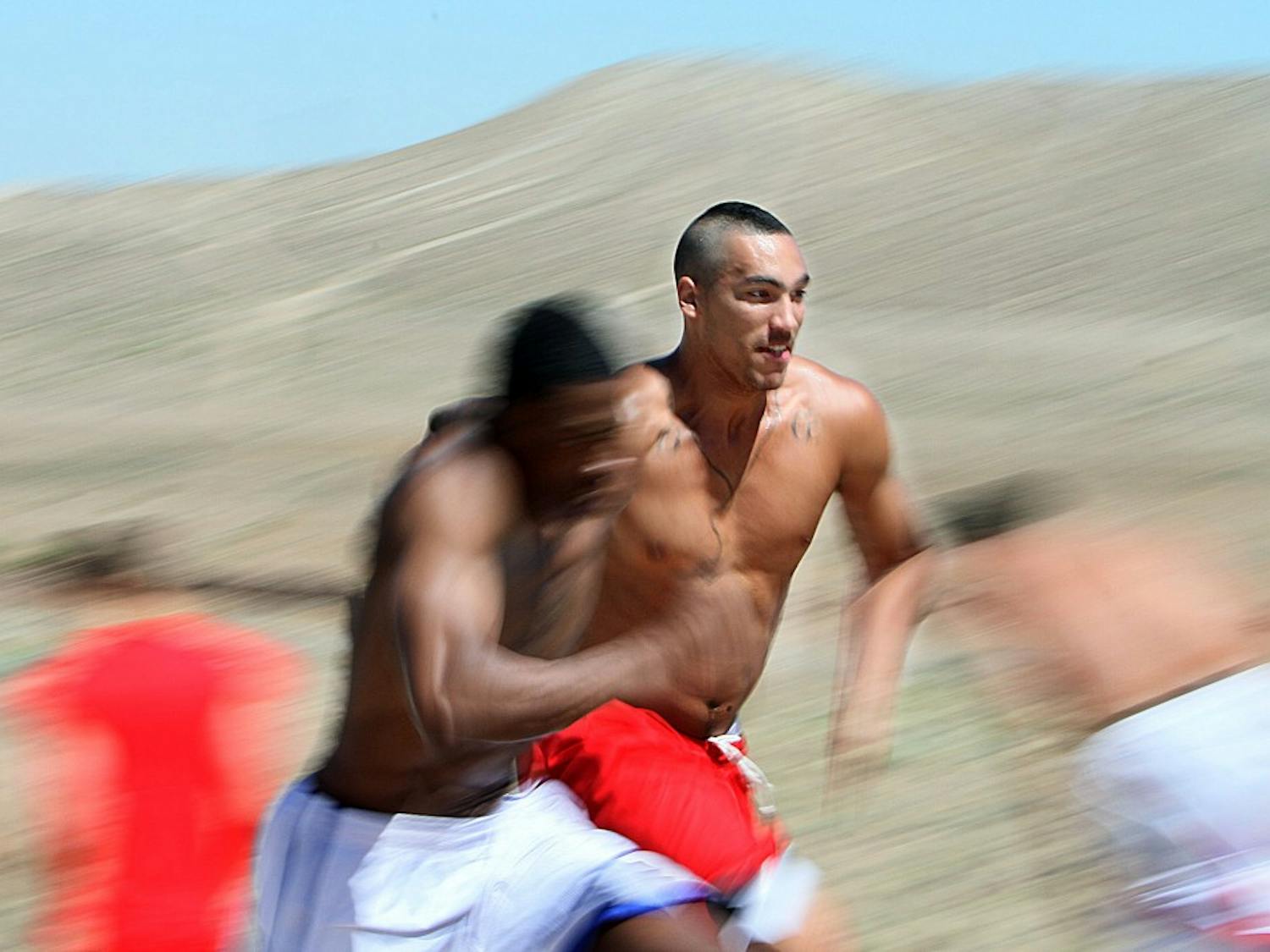 	UCLA transfer Drew Gordon sprints up hills during the Lobo basketball team’s rigorous workout on Saturday. The workouts, led by strength and condition coach Mark Paulsen, will be a part of UNM’s summer training regimen.