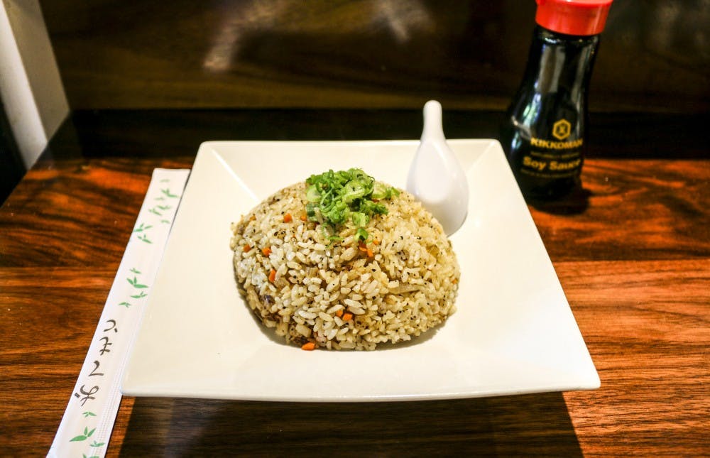 A bowl of vegan Japanese stir fry sits on the counter of Naruto on Wednesday, April 19, 2017. The Japanese stir fry is one of the many dishes that can be made vegan at Naruto. 