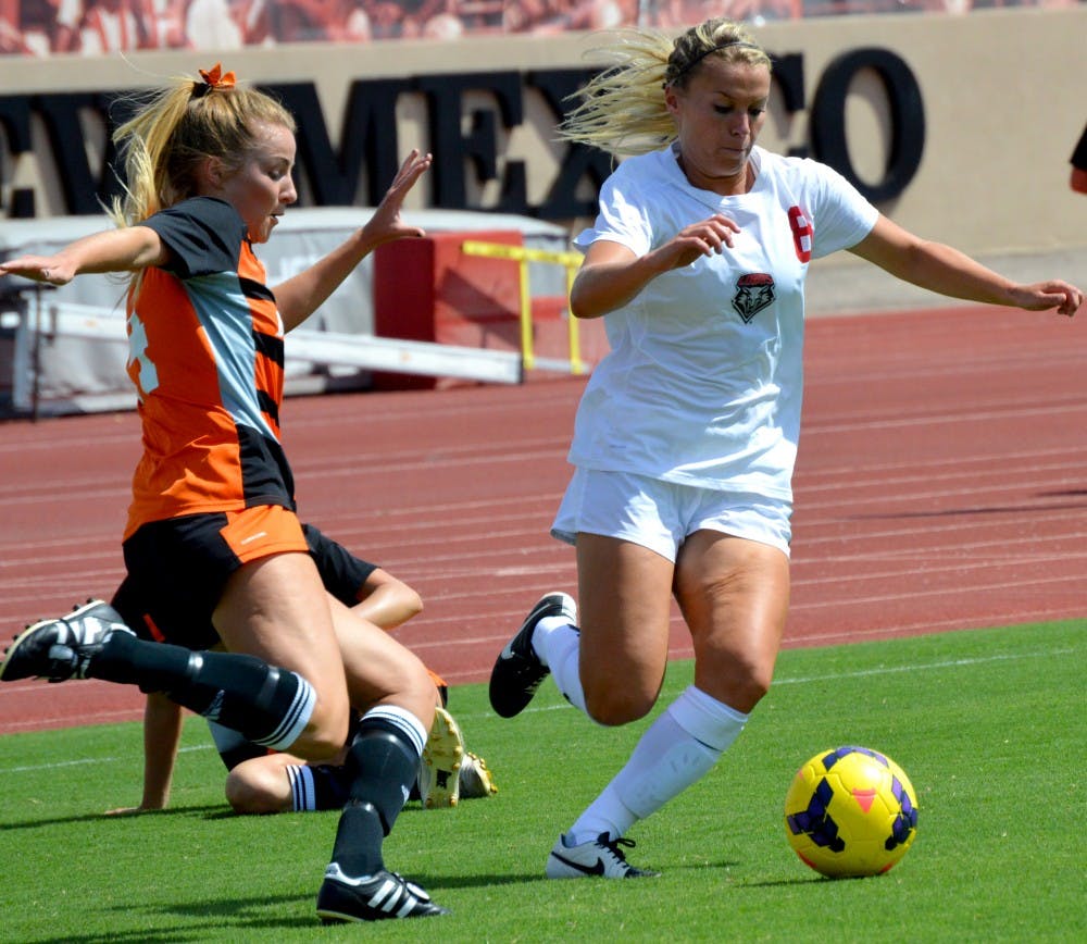 Lobo's forward Korynn Blanksma fights her way through two Idaho State players during their game Sept. 3, 2015. The Lobos are on the road playing Utah State this Friday. 
