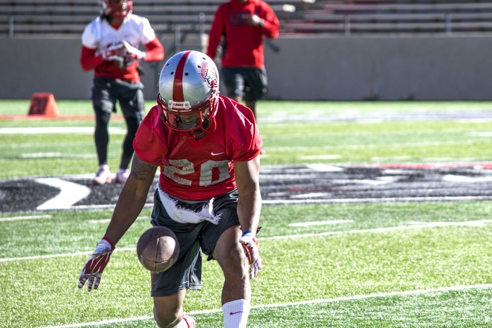 Junior running back Daryl Chestnut catches a pass Wednesday March 23, 2016 at University Stadium during a practice. The Lobos had a scrimmage last Friday and also hosted 75 coaches for a spring coaches clinic.