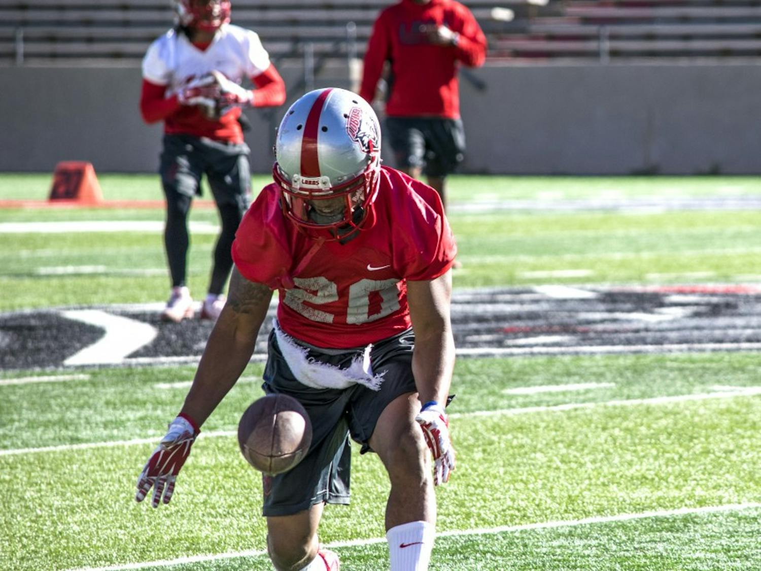 Junior running back Daryl Chestnut catches a pass Wednesday March 23, 2016 at University Stadium during a practice. The Lobos had a scrimmage last Friday and also hosted 75 coaches for a spring coaches clinic.