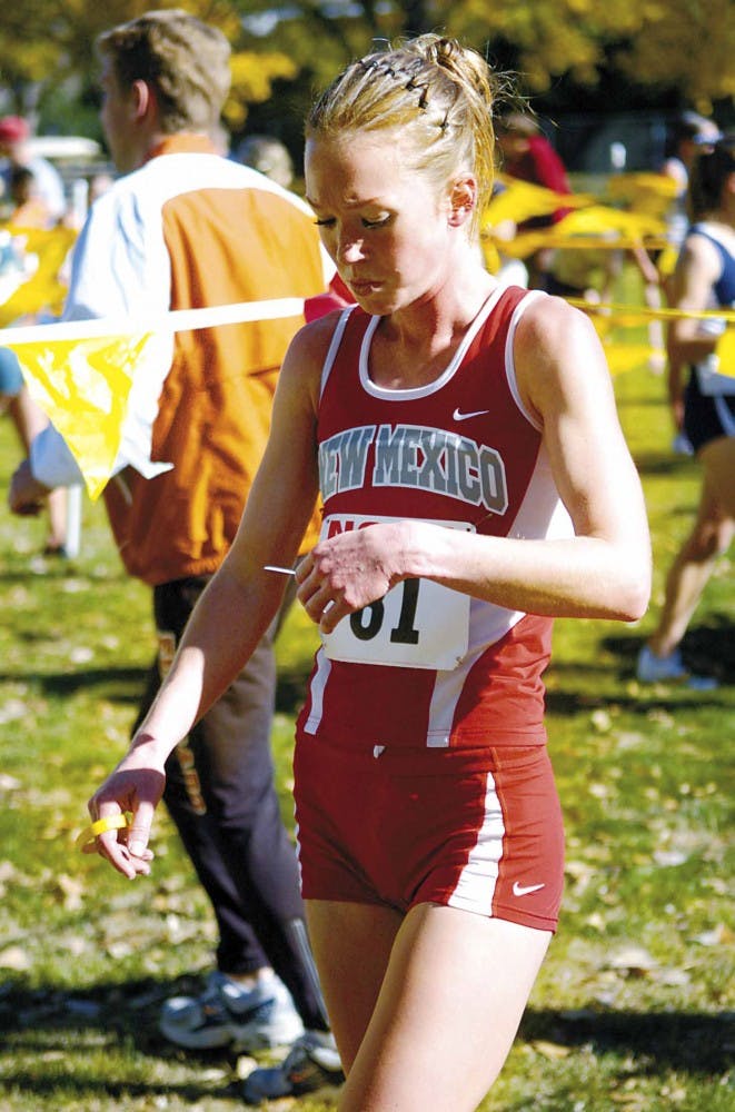 Lobo runner Timmie Murphy looks at her results after running in the 2006 NCAA Cross Country Championships Mountain Regional at the UNM North Golf Course on Nov. 11.