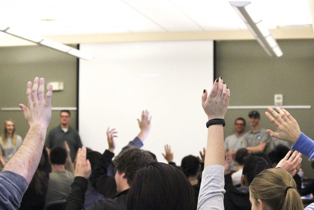 Students interested in joining Lobo EMS raise their hands during an informational meeting at the Acoma SUB rooms on Friday afternoon. Lobo EMS is UNMs first emergency medical service open to all students who would like to volunteer.