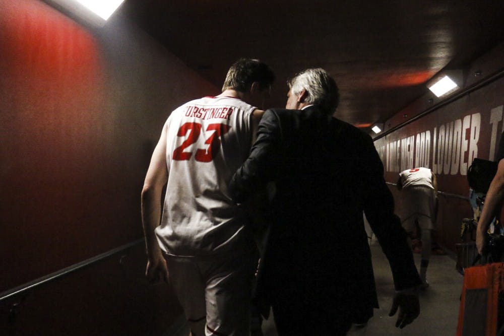 Head coach Craig Neal, right, and junior forward Joe Furstinger leave the court after defeating Wyoming University 78-71 on Saturday, Jan. 21, 2017 at WisePies Arena. The Lobos achieved their third straight victory against the Cowboys Saturday night.