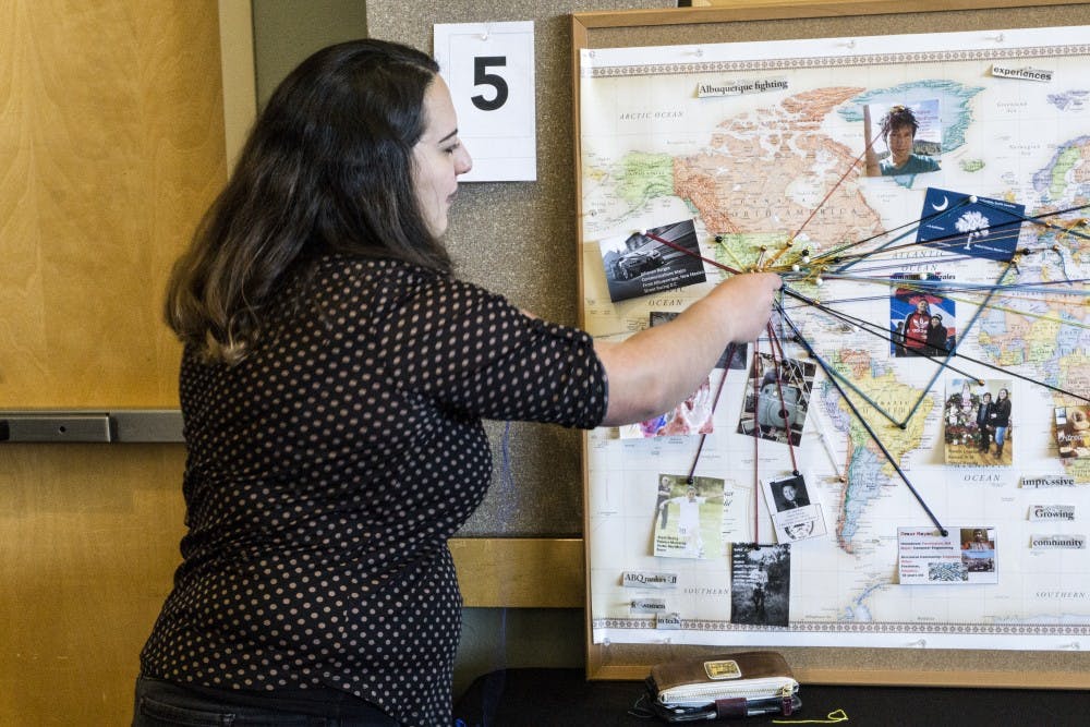 Malaka Friedman interacts with an exhibit at the Celebration of Student Writing in the &nbsp;SUB ballroom on March 8, 2018.