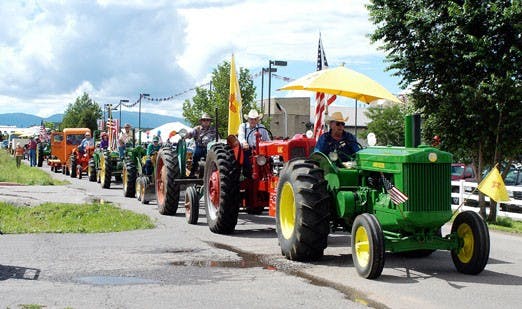 The antique tractor drive, shown above at last year's event, is one of many festivities at the Harvest Festival in Edgewood, NM. 