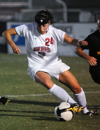 Forward Katie McKernan makes her way past defenders during Friday's 1-1 tie against Wisconsin-Milwaukee at the UNM Soccer Complex.  
