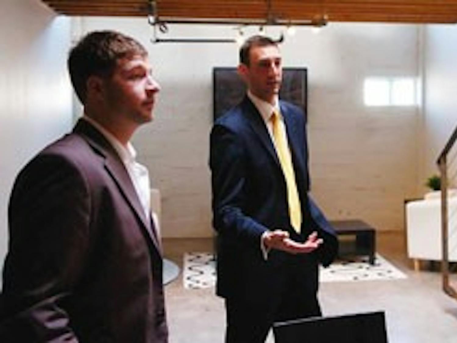 Ryan Bromberg, left, and Travis Thom of Venture Realty Group talk about first-time home buyers in Silver Hill Lofts on Gold Avenue and Buena Vista Drive on Tuesday.