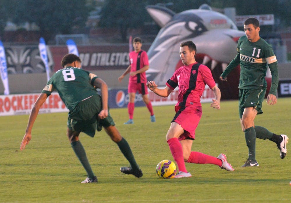 Midfielder Josh Goss goes up against a UAB defender during their game on Sunday. The Lobos play Marshall University this Friday in West Virginia.