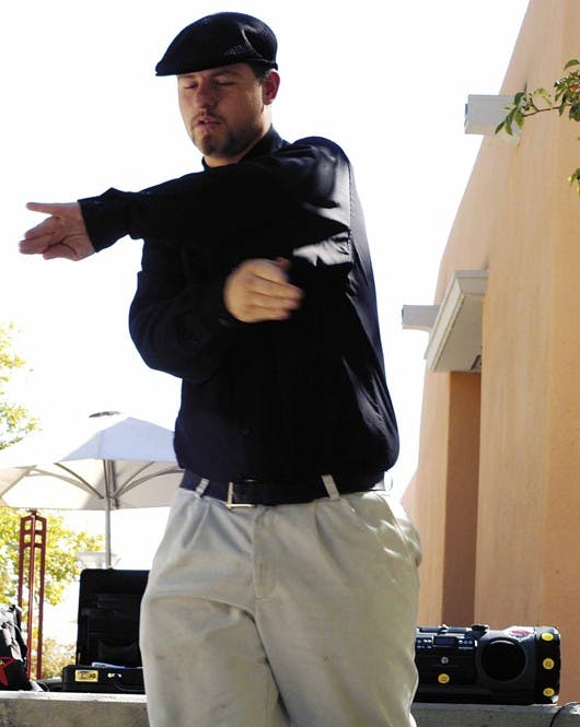 Joshua Arellano dances outside the SUB on Tuesday. Arellano said he dances in public to spread positive energy.