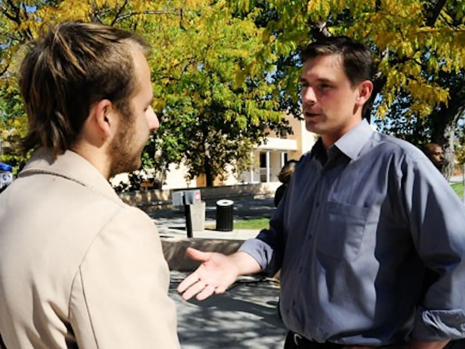 Congressional candidate Martin Heinrich, right, speaks with student John Besante near the SUB on Tuesday.