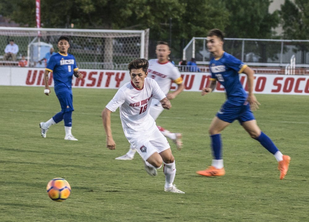 Nick Taylor chases down the ball during the first half of Tuesday’s game against UCSB at the UNM Soccer Complex. The Lobos lost 2-1.