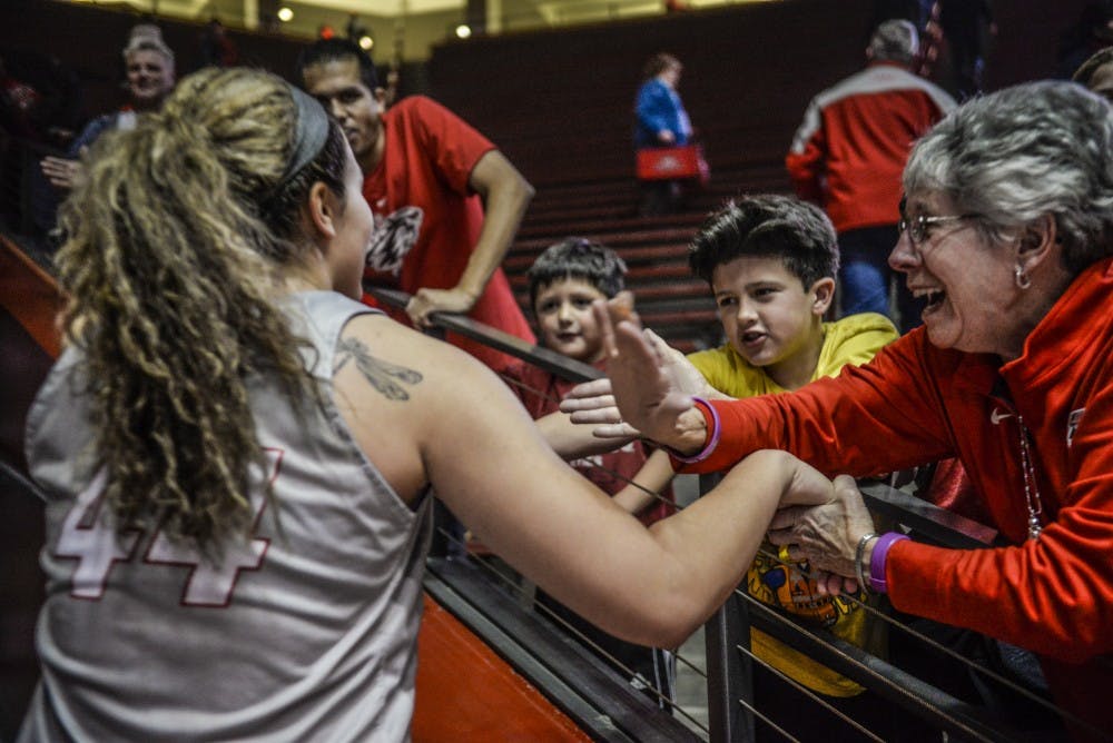 Sophomore center Jaisa Nunn is congratulated by&nbsp;Lobo fans as she walks off the court Wednesday, Jan. 1, 2016 at WisePies Arena. The Lobos defeated Utah State 78-67 putting their conference record 3-0.&nbsp;