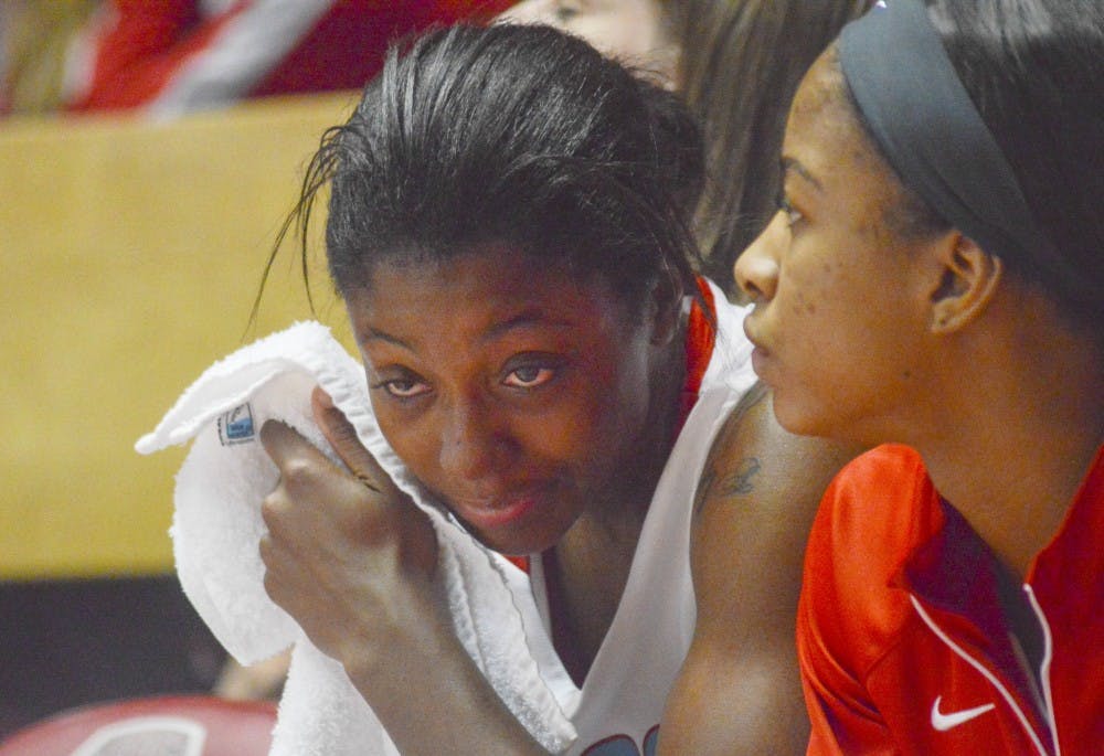 Lobo redshirt senior guard Antiesha Brown wipes her face after missing all of her free throws during the last minute of the game against Stanford at the Pit on Monday night. Despite a potential upset, the Lobos lost to Stanford 70-65.