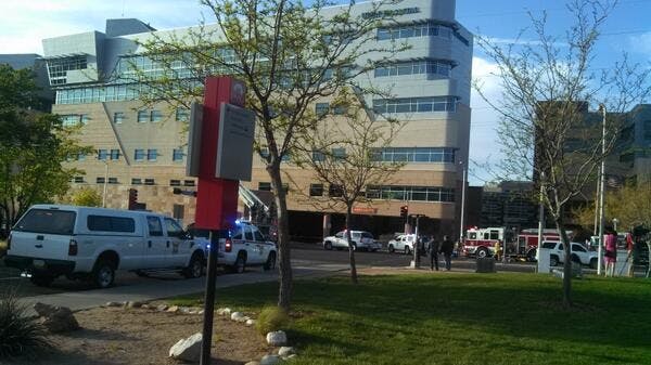 	Emergency personnel respond to UNM Hospital Wednesday evening after a helicopter crashed on the hospital’s roof.