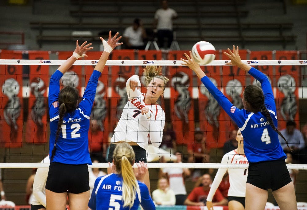 Victoria SPragg finsihes a spike against Air Force on September 