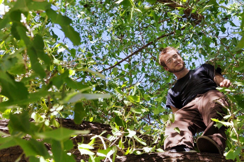 	Graham Gentz, an actor, screenwriter and scientist, relaxes in a tree.