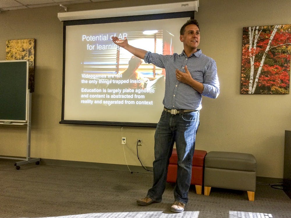 Professor Chris Holden talks to students about the educational possibilities&nbsp;of augmented reality programing.