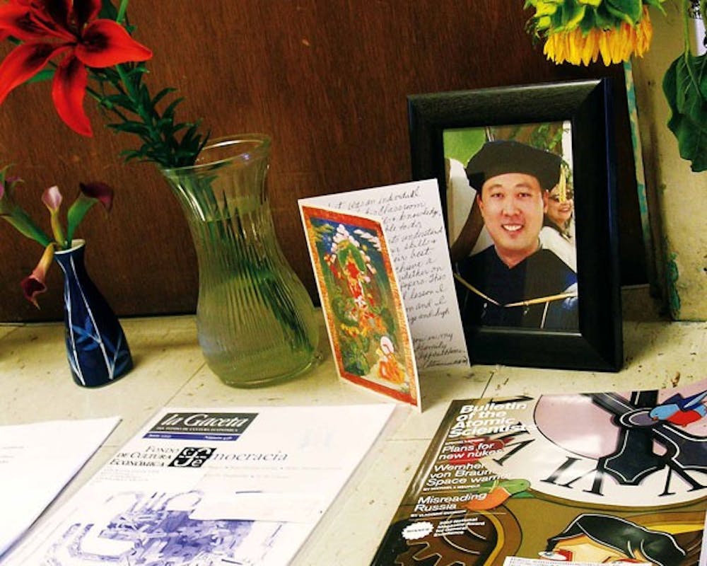 Students and staff have left cards and flowers outside UNM associate history professor Tim Moy's office in Mesa Vista Hall. Moy drowned July 22 at Kailua Beach, Hawaii, while trying to help his 12-year-old son, who was having difficulty swimming. 