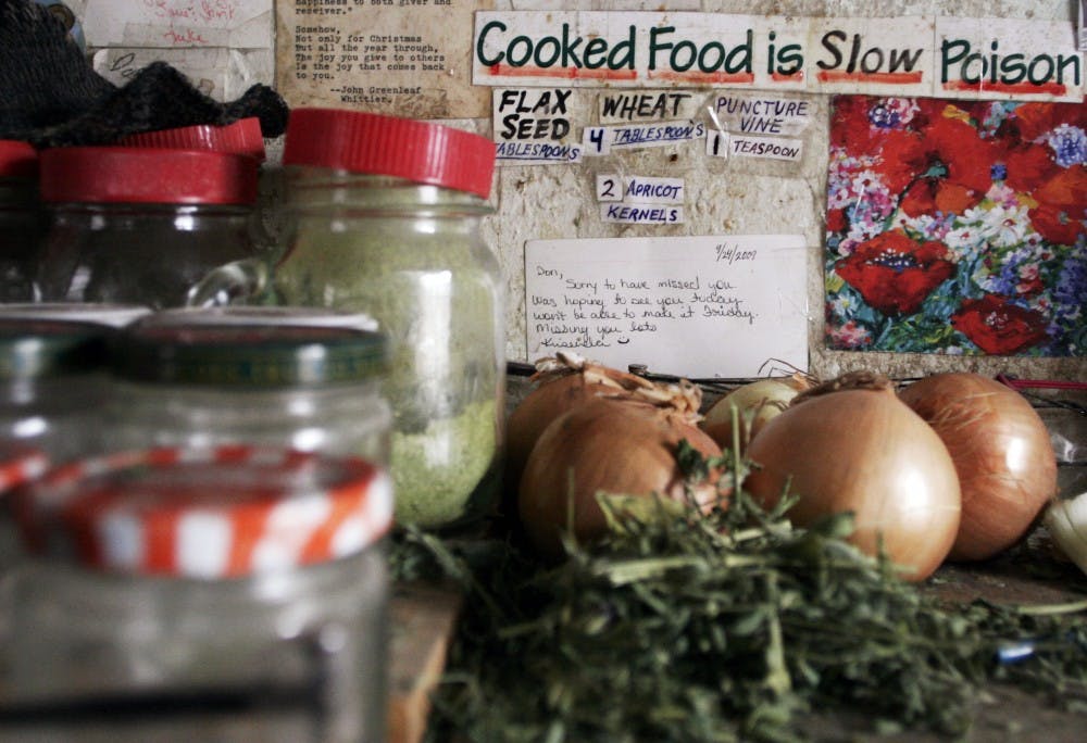 	Don Schrader eats mostly fresh vegetables because he said cooked food is unhealthy for the body. In the jars to the left, he mixed vegetables and other food together to create his morning smoothie. In an entire year he said he spent little more than $1,000 on food.