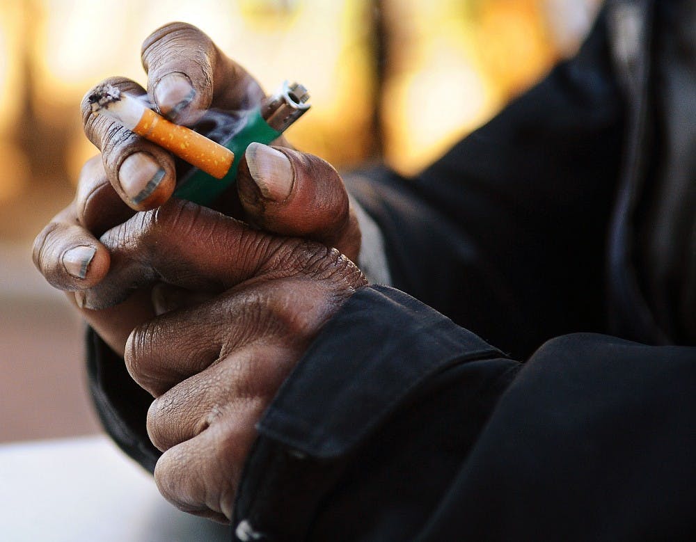 	Johnny smokes his cigarettes down to a smoldering filter. Over the years, this has turned his fingertips black.