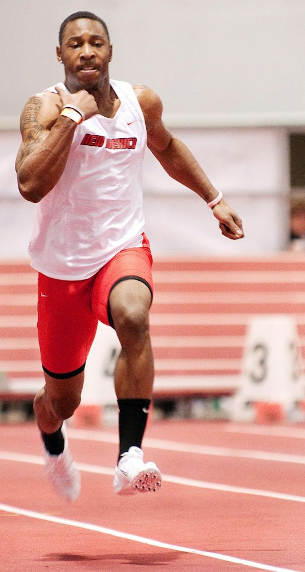 	Lamaar Thomas whirls down the track at the Albuquerque Convention Center on Saturday. Thomas, who transferred from Ohio State to play UNM football, is currently competing in track and field during the mandatory NCAA waiting period.