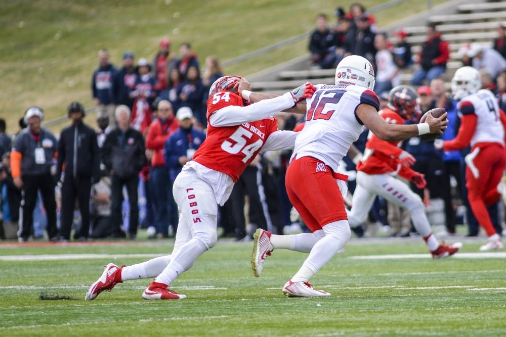 Senior linebacker Donnie White (54) attempts to take down Arizona's Anu Solomon during the 2015 Gildan New Mexico Bowl. The Lobos will focus on secondary teams to ramp up their defense for the 2016 season.&nbsp;