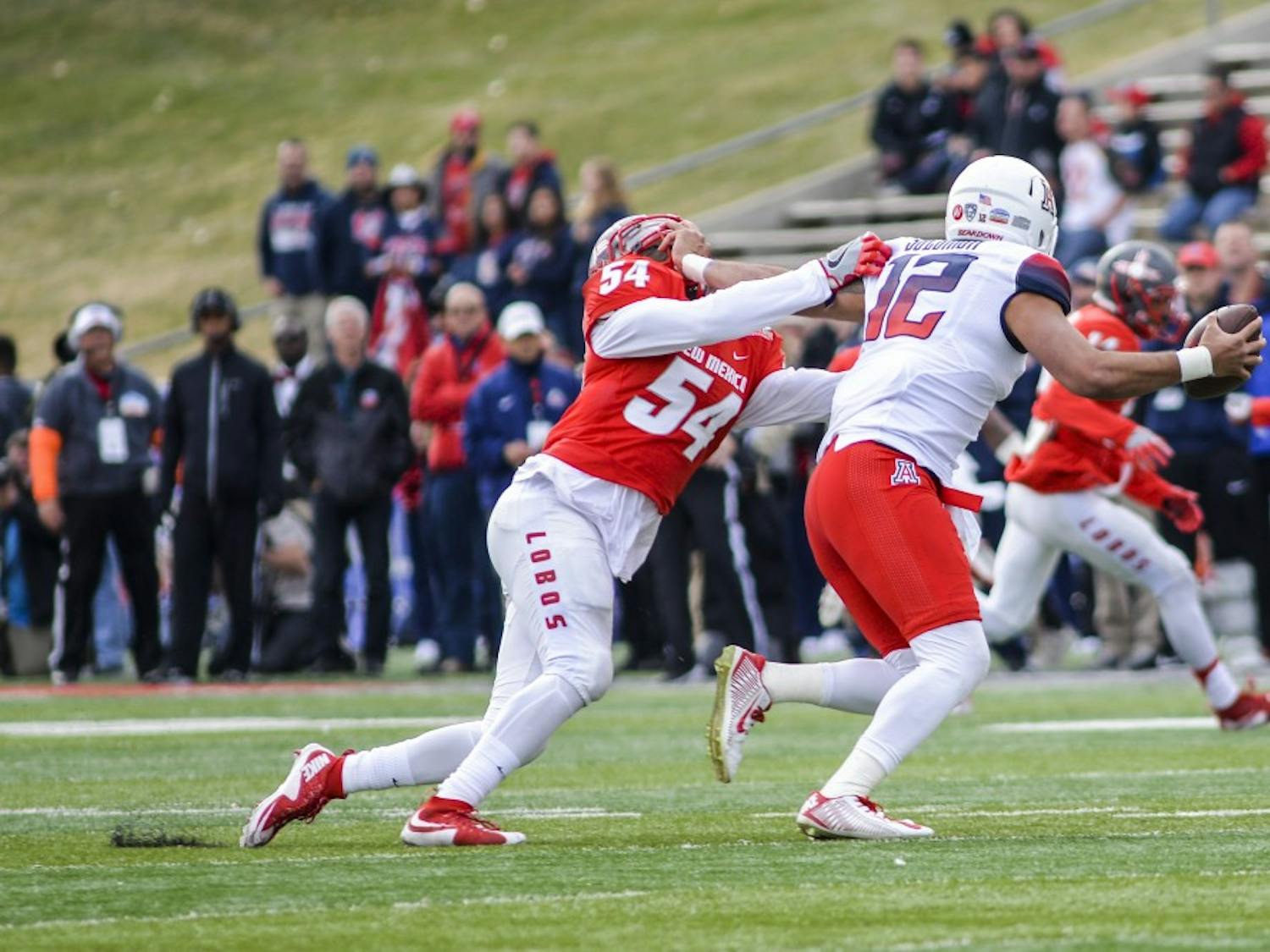 Senior linebacker Donnie White (54) attempts to take down Arizona's Anu Solomon during the 2015 Gildan New Mexico Bowl. The Lobos will focus on secondary teams to ramp up their defense for the 2016 season.&nbsp;