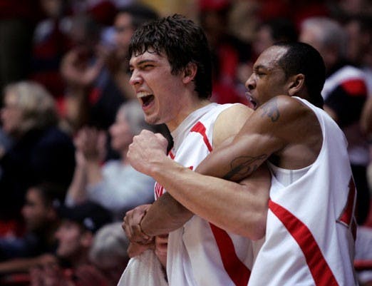 Daniel Faris and J.R. Giddens celebrate during Saturday's 100-55 win against Wyoming in the Pit. 