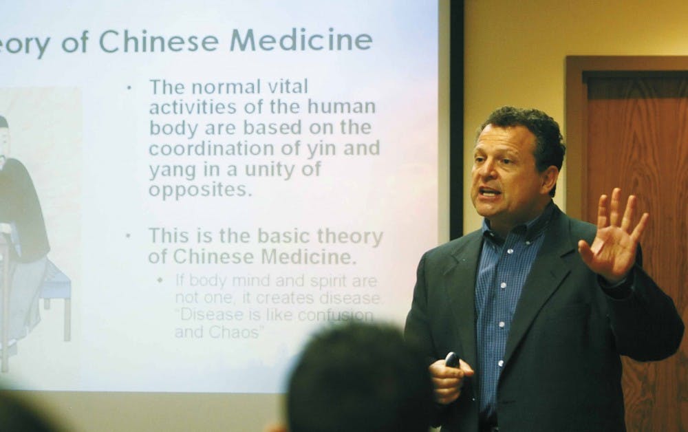 Dr. Paul Magarelli, director of UNM's Reproductive Medicine and Fertility Center, talks about reproduction during his "In Search of the Stork" seminar at the Cancer Research and Treatment Center on Monday. 