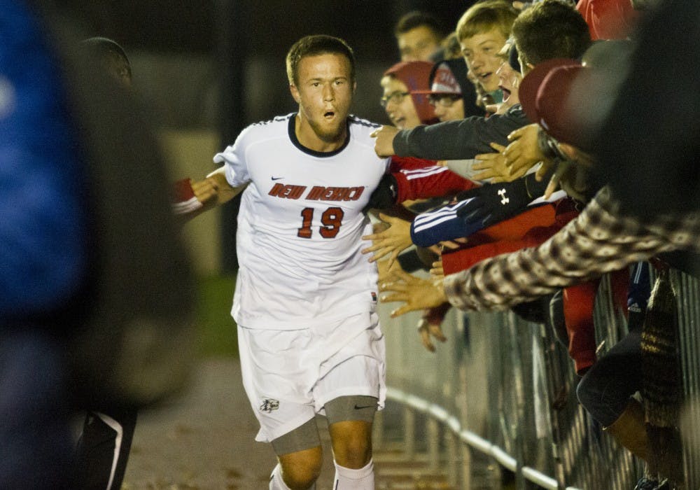	UNM freshman midfielder Ben McKendry celebrates a goal with fans during the Mountain Pacific Sports Federation tournament semifinals Friday night at the UNM Soccer Complex. McKendry had two goals, leading the Lobos to a 3-0 win. UNM will play Air Force in Sunday’s finale at 1 p.m.