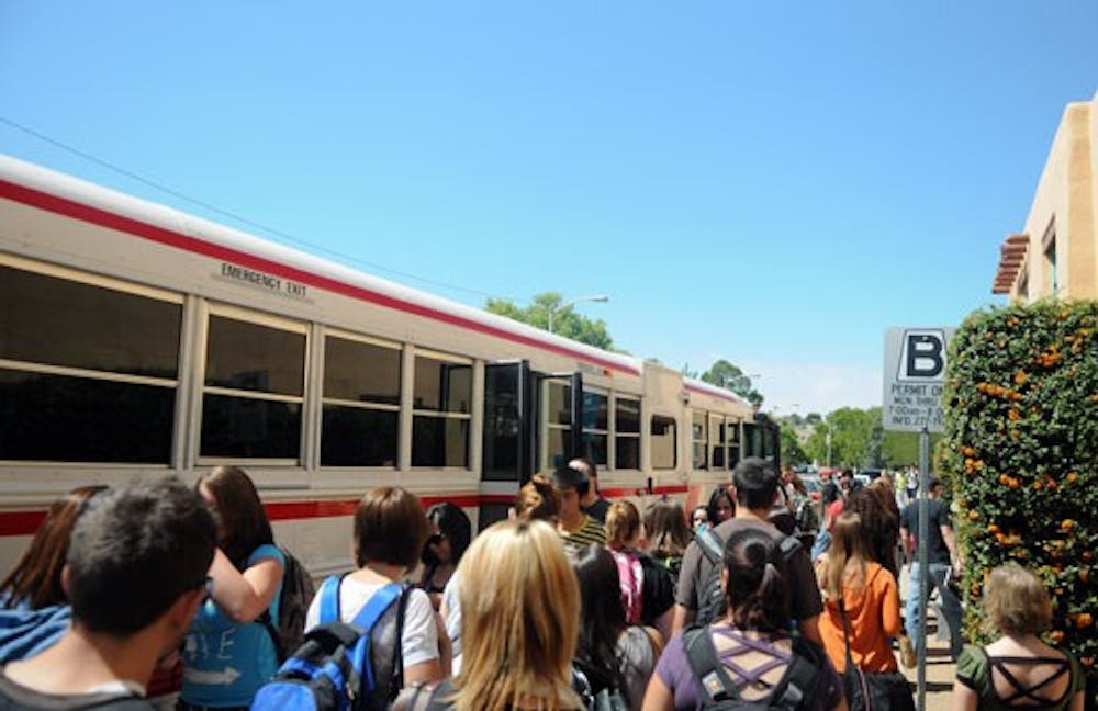 Students board a shuttle bound for South Lot on Tuesday. Of UNM's nearly 25,000 students, 21,000 commute to campus, according to the University. 